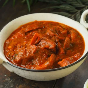 Oxtail Stew — Rich slow-cooked oxtail in savory gravy with butter beans.
