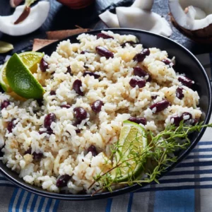 Rice and Peas — Coconut rice cooked with pigeon peas and island seasonings.
